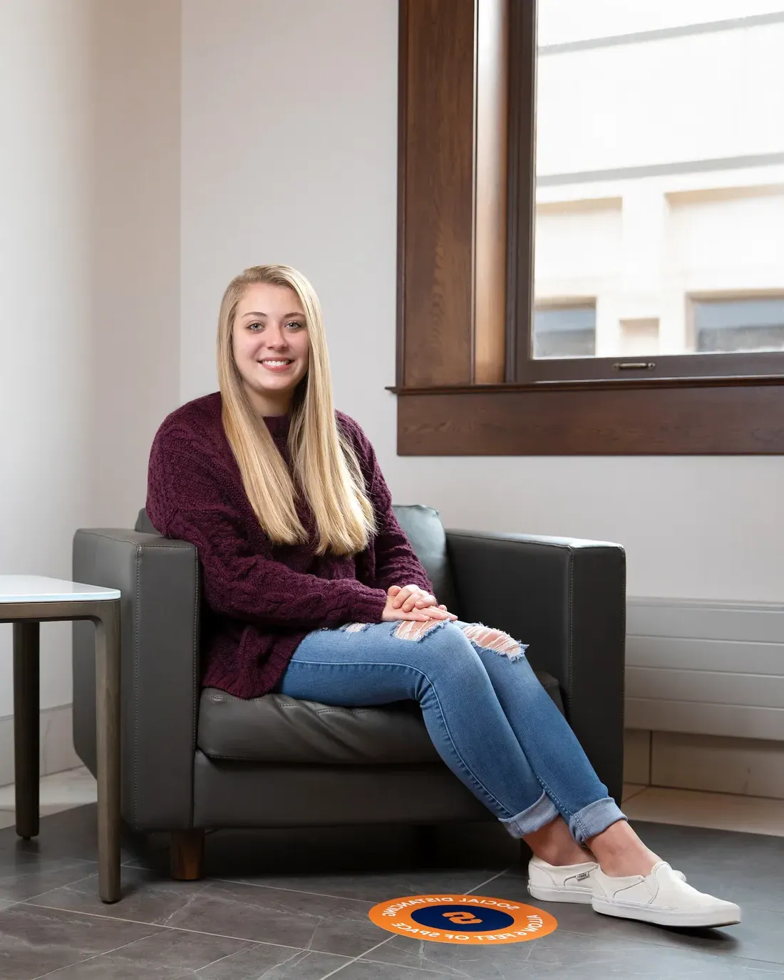 Transfer student Alisamarie Yiatras sitting and smiling.