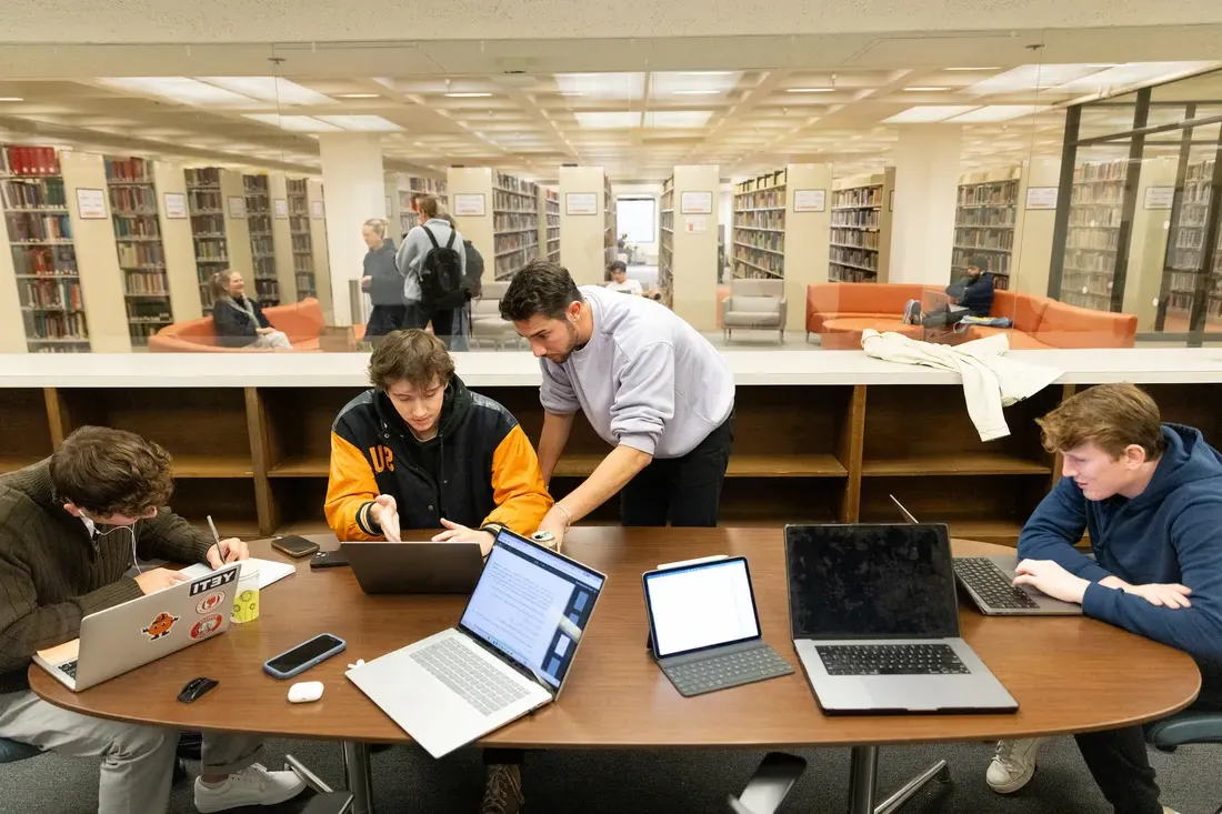 People working together in a group classroom at the library.